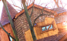 Load image into Gallery viewer, Marley cedar shakes installed vertically on treehouse property