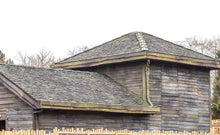 Load image into Gallery viewer, Marley cedar shakes installed vertically on a ride at alton towers