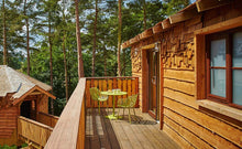 Load image into Gallery viewer, Marley Shingles installed vertically and horizontal on a treehouse property
